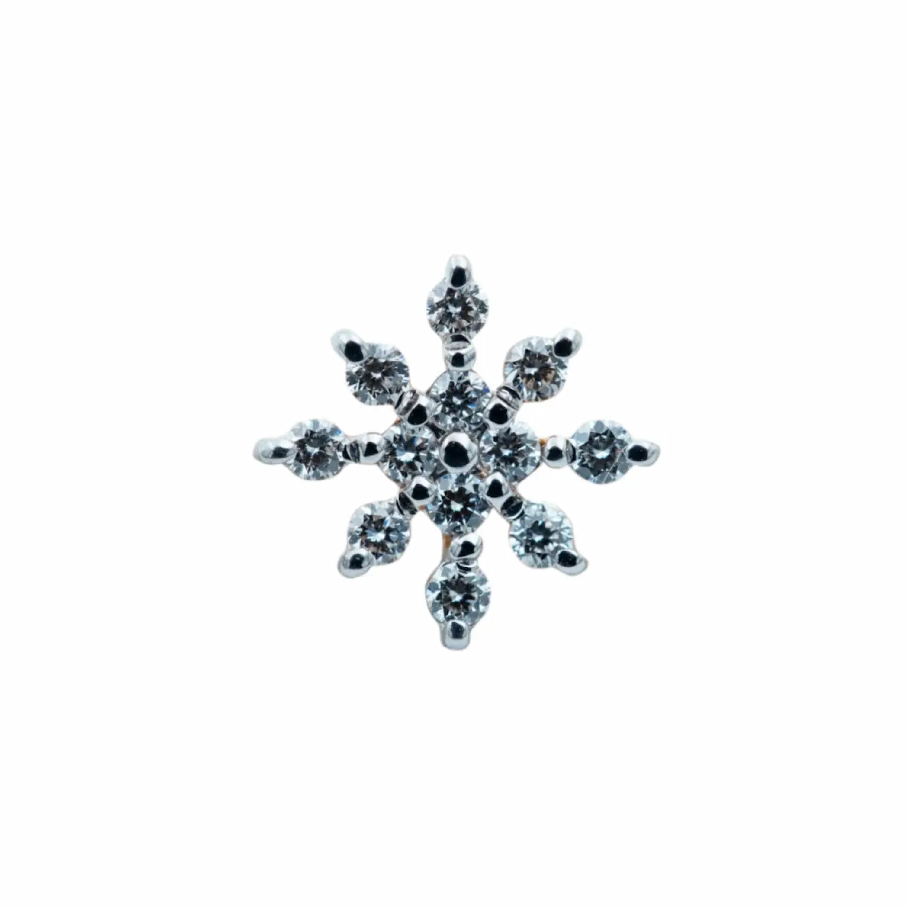 Multi-stone round brilliant diamond nose pin in 18k gold with a prong setting, showing stone arrangement and metal finish.