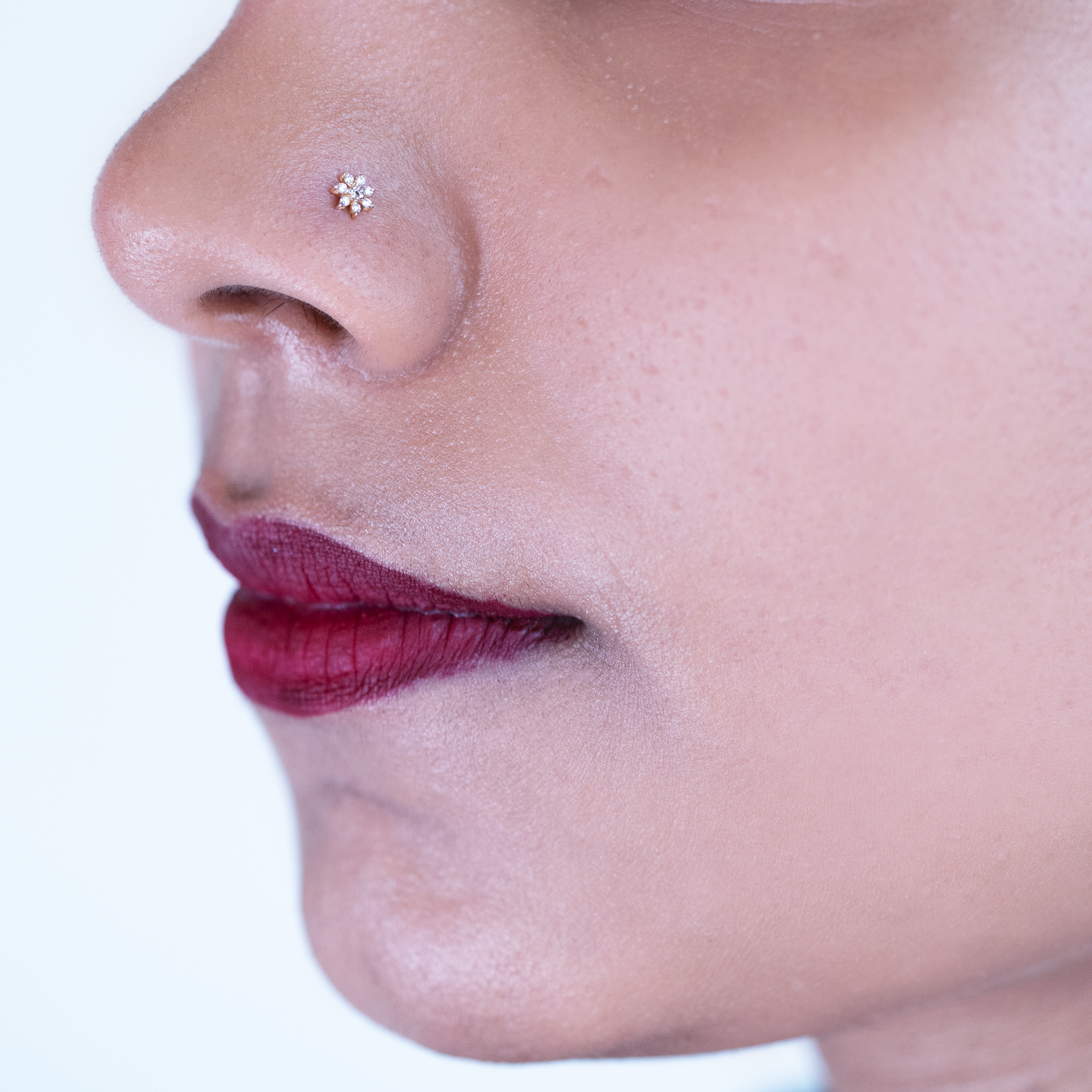 model wearing flower diamond nose pin