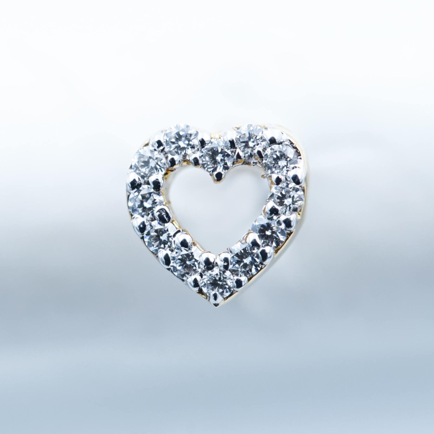 love shaped diamond nose pin jewelry for women in white background.