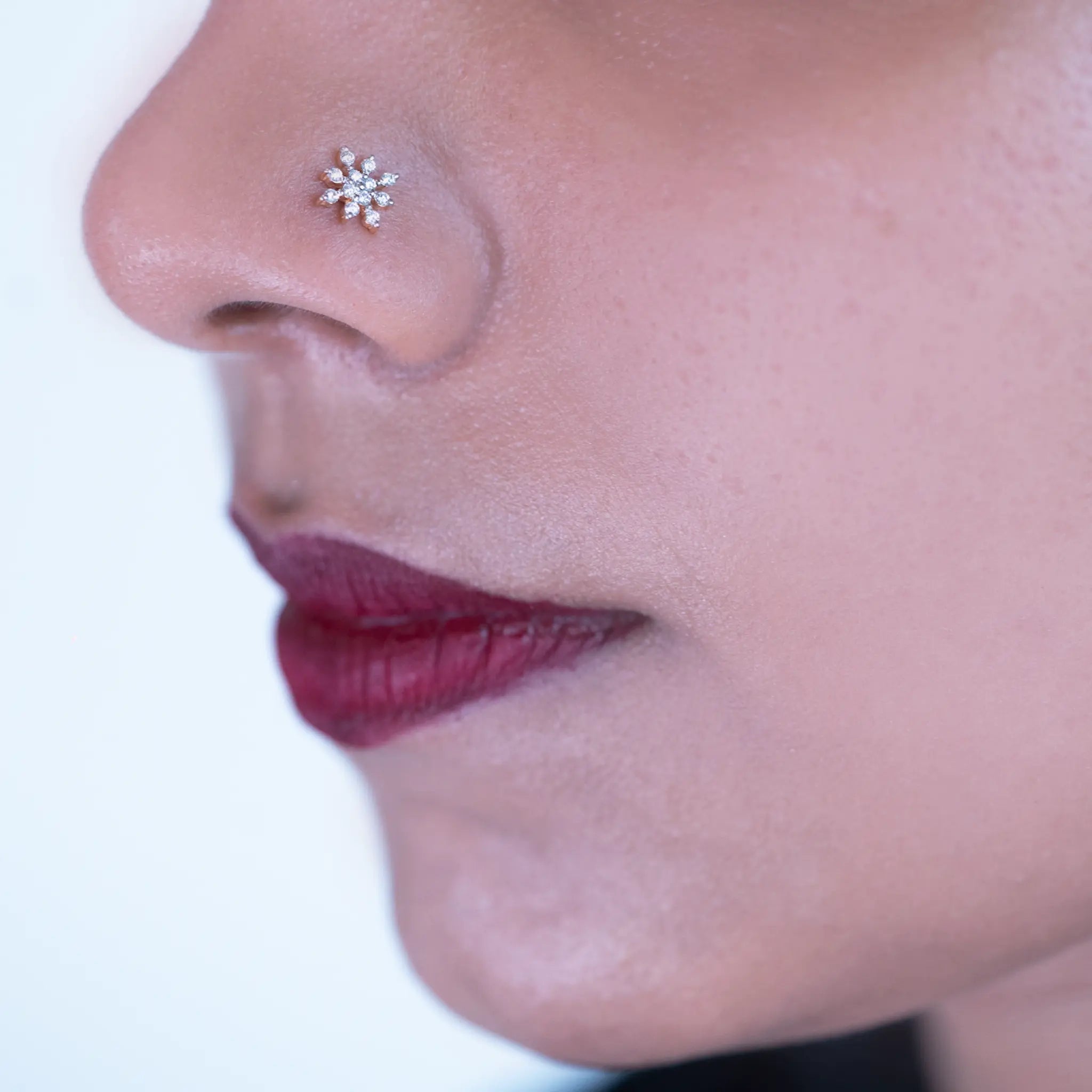 model showcasing Damaru's elagant diamond nose pin 