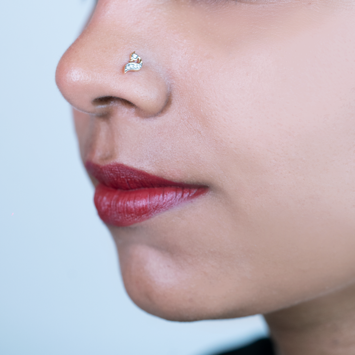 model wearing peacock design diamond nose pin 
