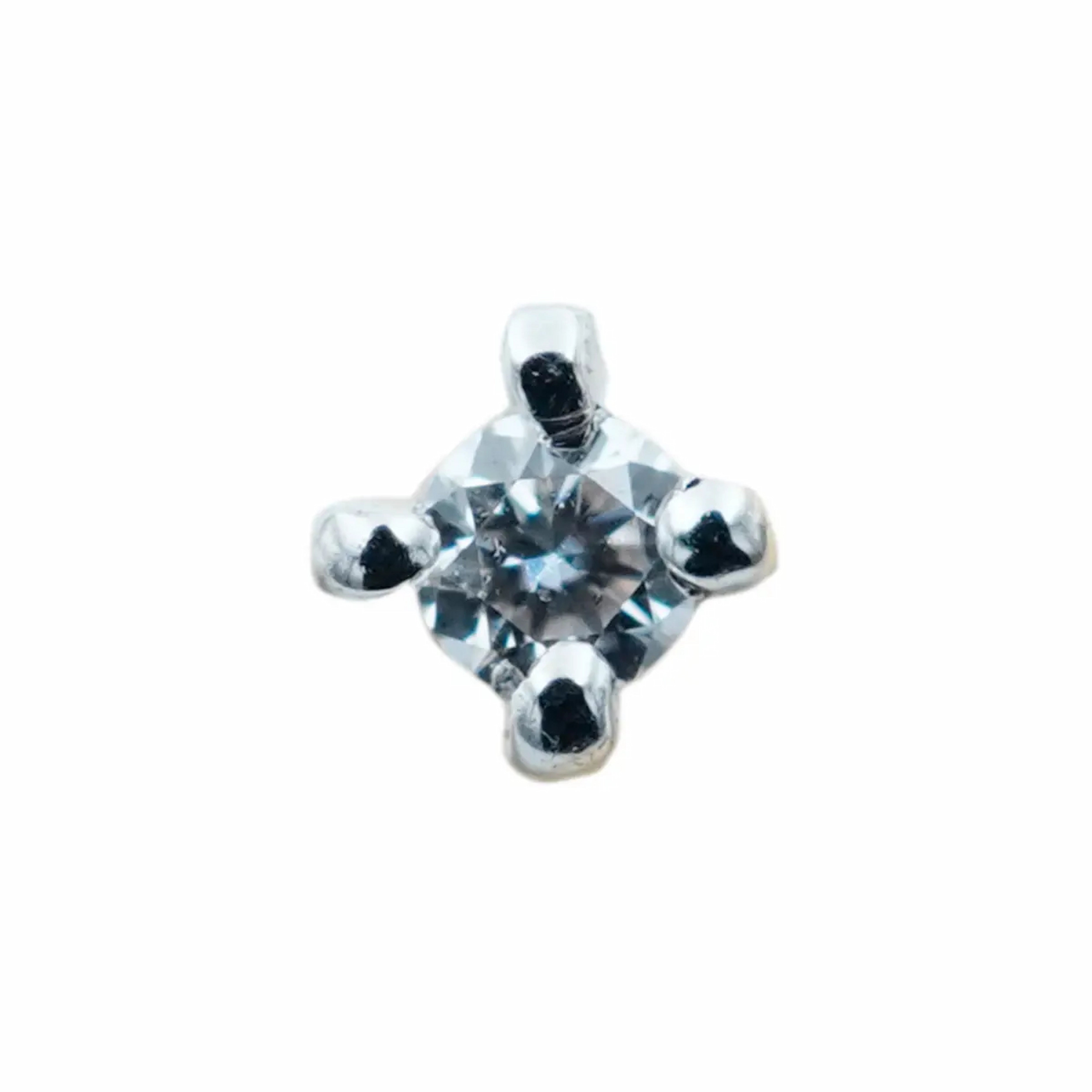 close up image of one stone diamond nose pin in 18k gold from Damaru gold and Diamonds