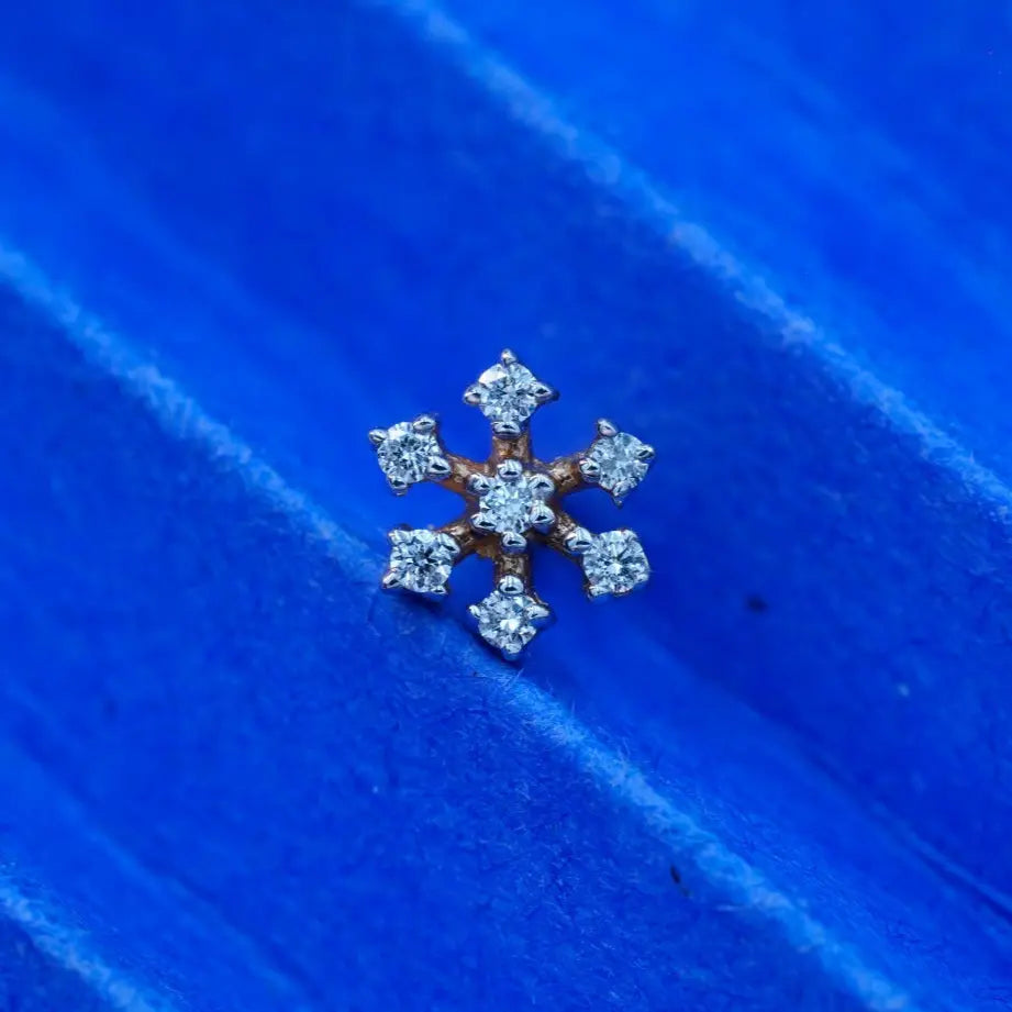 flower shaped diamond nose pin, showing the design perfectly.